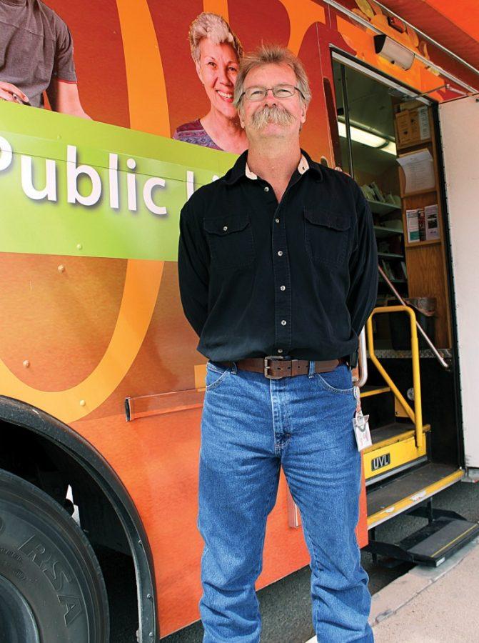 Robert Alcaraz/ Arizona Daily Wildcat
Wade Zelenak, the Pima County Public Library Bookmobile driver, stands in the bus where he checks books out to students on the UA Mall on Oct. 4, 2011. Zelenak has been the Bookmobile driver for 16 years.