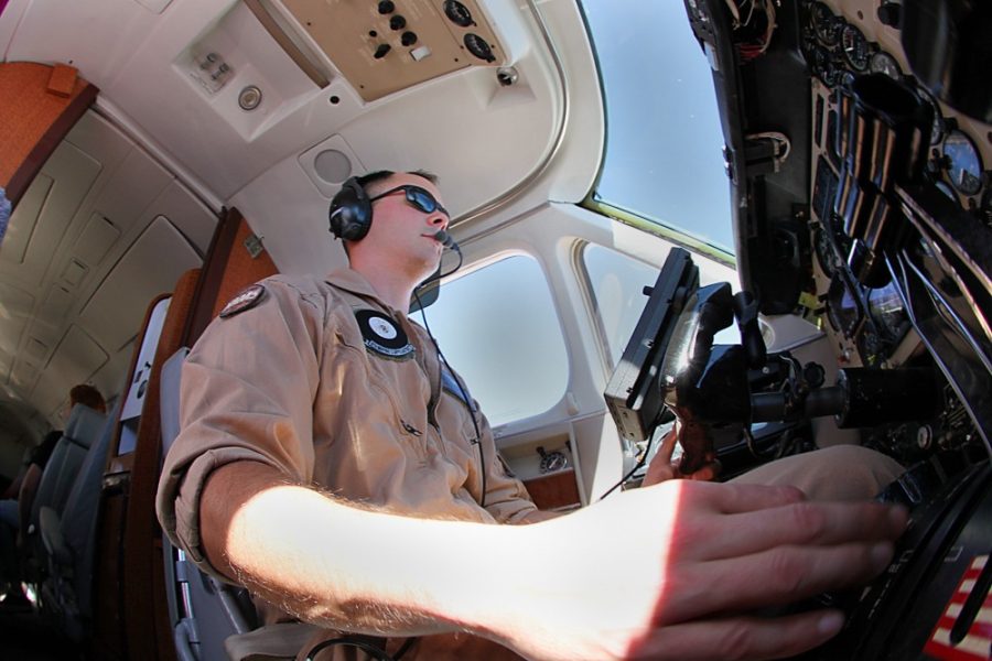 Janice Biancavilla/ Arizona Daily Wildcat
Marine pilot Dave Mathes demonstrates flying techniques during a Marine Corps Flight Orientation Program flight. The program is designed to offer first hand flying experience for people interested in joining. 