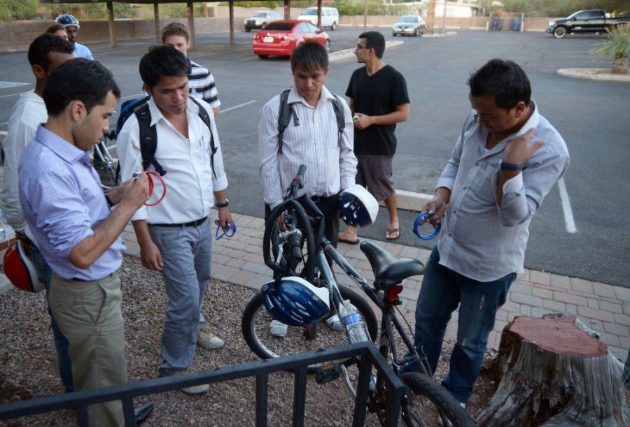 Colin Prenger / Arizona Daily Wildcat

Refugees from several foreign countries learn the basics of traveling by bicycle around Tucson. Members of the International Rescue Committee and several UA students participated in this event Tuesday, Oct. 25. 
