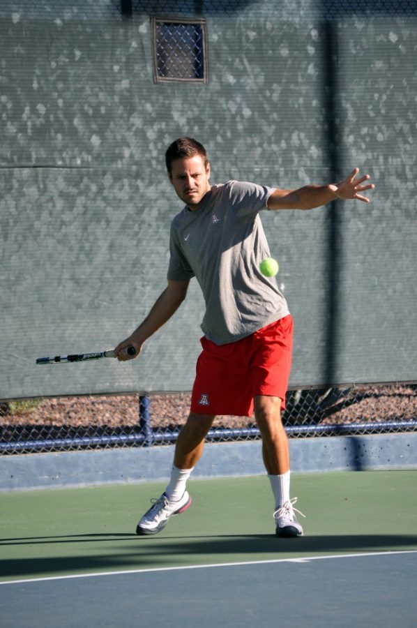 Alex Kulpinski / Arizona Daily Wildcat

Mens Tennis Assistant Coach Andres Carrasco takes practice swings at the Robson Tennis Center Wednesday morning.  