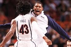 UA forwards Jordan Hill and Fendi Onobun celebrate during a 71-57 Arizona win against Cleveland State on Sunday in AmericanAirlines Arena in Miami. With the Win, the Wildcats will play overall No. 1 seed Louisville in the Sweet 16 on Friday in Indianapolis.