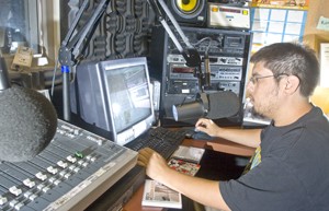 Adam Guerrero, KAMP alternative music director, conducts his afternoon radio show. 