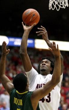 UA forward Jordan Hill goes up for a shot against Oregon guard Bryce Taylor during the Wildcats 84-74 loss Jan. 5 in McKale Center. Hill will come up big tonight when Arizona plays at Stanford and its twin powers Brook and Robin Lopez.