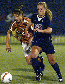 Arizonas Jacqueline Zinke drives the ball downfield while fighting off a Texas player during the Wildcats 2-0 win over the Longhorns Sunday night at Murphey Stadium. Zinke and teammate Samantha Drees prepared for this season by playing in national championship games with their respective club teams. 