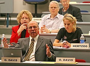 Provost George Davis answers questions during the Faculty Senate meeting yesterday afternoon at the James E. Rogers College of Law building. Davis explained budget issues surrounding the Arizona Board of Regents.