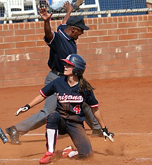 Claire C. Laurence/ Arizona Daily Wildcat

Sophomore outfielder Adrienne Acton smiles as the home plate umpire calls Safe after sliding across home in the fourth inning. No. 1 Arizona deafeated visiting Long Beach 11-0 in a five inning shutout on Sunday in Hillenbrand Stadium.