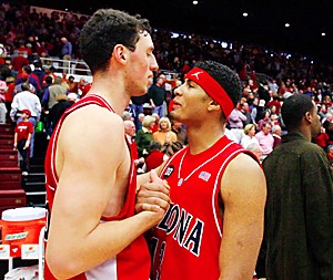 Chris Rodgers (left) high fives Ivan Radenovic after Arizona beat Stanford 76-72, Sunday, Feb. 19, 2006 at Maples Pavilion in Stanford, Calif. (Photo by Chris Coduto/Arizona Daily Wildcat)