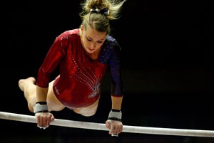 Arizona senior gymnast Karin Wurm performs on the uneven bars during a March 21 meet in McKale Center. The No. 14 Gymcats take part in the NCAA North-Central Regional Saturday in Minneapolis and a top-two finish would punch their ticket to the NCAA Championships in Athens, Ga., April 24.