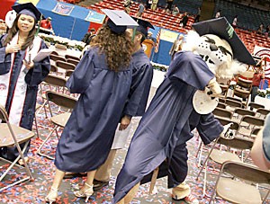 UA mascot Wilbur T. Wildcat, right, rears back to throw a tortilla at the spring 2005 afternoon graduation ceremony. Campus administrators are still worried that tortillas could injure or offend students and their families at next weeks commencement ceremony.