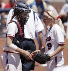 Arizona catcher Callista Balko, left, and pitcher Taryne Mowatt exchange words in a 2-1 loss to UCLA at Hillenbrand Stadium on April 13. The seniors are playing professionally for the Washington, D.C. Glory this summer.