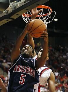 Arizona guard Jawann McClellan goes up for a shot over San Diego State forward Mohamed Abukar during the second half of the No. 10 Wildcats 69-48 win at San Diego State Dec. 9. McClellan, along with guard Nic Wise and forward Fendi Onobun, is a Wildcat from Houston looking for revenge after the Cougars beat Arizona last season.