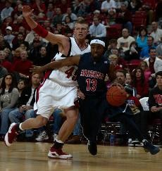 Arizona guard Nic Wise (13) pushes past UNLV forward Joe Darger in a 79-64 Rebel win in Thomas & Mack Center on Saturday. Kansas head coach Bill Self said it will be tough for his Jayhawks to defend Wise, Jordan Hill and Chase Budinger -