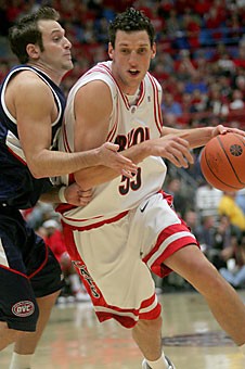 Senior forward Ivan Radenovic (right) drives past Randall Gulina of Samford in Arizonas 86-57 win over the Bulldogs Wednesday in McKale Center. Radenovic, who is second in the nation in field-goal percentage, leads a Wildcat squad that ranks fourth in field-goal percentage against UNLV today in McKale Center. 