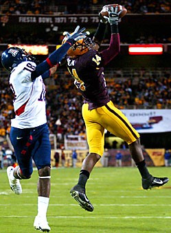 ASU safety Troy Nolan intercepts a Willie Tuitama pass intended for wide receiver Delashaun Dean in Saturdays 20-17 Sun Devil win over Arizona in Tempe. Tuitama had two interceptions and also lost a fumble in the Wildcats season finale. 