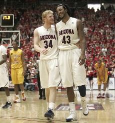 UA forwards Chase Budinger, left, and Jordan Hill share a lighthearted moment in the closing seconds of a 83-76 Wildcat win Thursday night in McKale Center. The two juniors combied for 37 points and 11 rebounds as Arizona won its fifth-straight game in Pacific 10 Conference play.