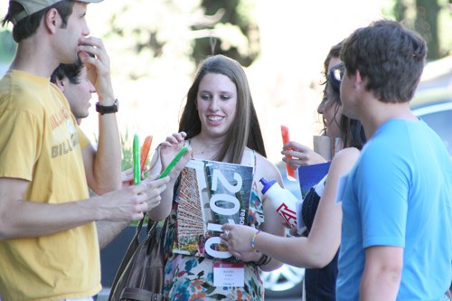 Gordon Bates / Arizona Daily Wildcat 
Jennifer Lurie, an incoming political science freshman from California, receives an Otter Pop from the members of Chi Alpha. Jennifer was part of Mondays new freshman welcome event on University Boulevard.