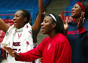 Centers Suzy, left, and Beatrice Bofia, right, celebrate with guard Joy Hollingsworth during the Grand Canyon on Nov. 6. TThe womens team, very close off the court, hopes that chemistry shows in the win column on the court.