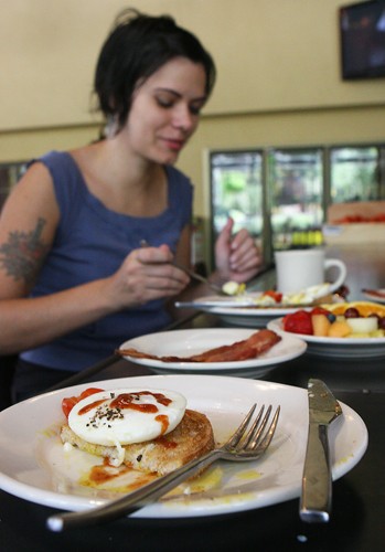 Erich Healy/ Arizona Daily Wildcat

Penny Ridgdill, a Mathematics Ph.D. Candidate and Teaching Assistant, trys the Two Poached Eggs on Toast with a side of bacon and fruit from Wilkos new breakfast menu.
