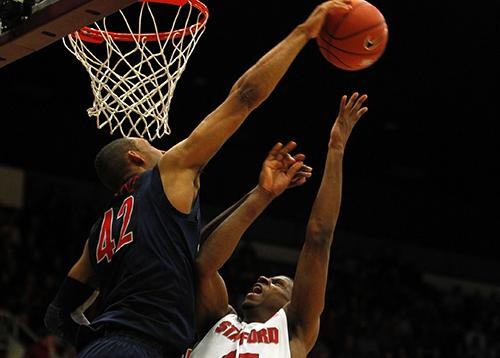 Arizona?s Jamelle Horne, left, blocks a shot, and fouls, Stanford?s Jeremy Green (45) in the first half at Maples Pavilion in Stanford, California, on Wednesday, February 3, 2011. Arizona defeated Stanford, 78-69. 