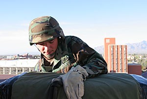 Education junior and Army ROTC Company Commander Chris Glasser edges over the roof of the Henry Koffler building yesterday afternoon during a rappelling exercise.