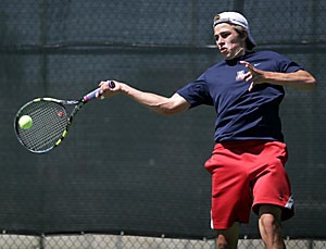 Freshman Alex Labrosse volleys during Arizonas 4-3 loss to California March 31. Labrosse and the Wildcats have struggled through a disappointing 5-17 season, and are riding an 11-match losing streak.