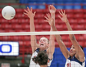 Freshman outside hitter Whitney Dosty, right, and freshman middle blocker Jacy Norton jump to block during the Arizona volleyball teams sweep of Montana State on Friday during the Four Points Sheraton Wildcat Classic in McKale Center. The Wildcats also swept Bradley on Friday but lost in five sets yesterday to Rice. 
