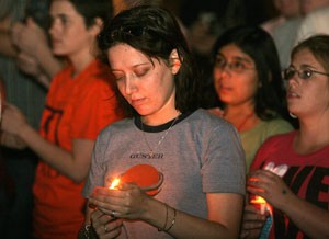 Shelley Meisel, a photography senior, participates in a candlelight vigil held last night on the UA Mall in remembrance of Lawrence King, an openly gay 15-year-old who was beaten and killed. The vigil was a continuation of the Day of Silence, a three-day event highlighting LGBTQ abuse through harassment and bullying.