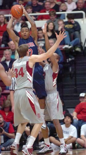 Freshman guard Momo Jones attempts to pass out of a double team during the Wildcats? 71-69 victory against Stanford in Palo Alto, Calif. Jones banked in a 16-footer as time expired to lift Arizona over the Stanford Cardinal. 