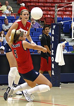 Junior libero Brittany Leonard sets a ball in Sundays Red-Blue scrimmage in McKale Center. Seniors Katie Jackels and Emily Harper and junior Audrey Bockerstette, are competing with Leonard for time at the position.