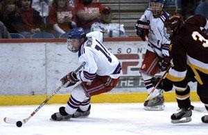 Forward Robbie Nowinski, left, drives the puck toward the goal in Fridays 6-5 overtime win against ASU in the Tucson Convention Center. The attendance, 6,500, was the most for one game in more than eight years.