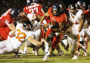 UA running back Keola Antolin tries to break free from Oregon State safety Greg Laybourn (44) during a 19-17 Beaver win Saturday night at Arizona Stadium. Antolin finished the night with 114 yards and one score on 25 carries.