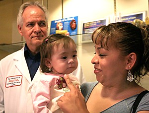 Claire C. Laurence / Arizona Daily Wildcat

17-month old Tiana Lopex was the recipient of a Berlin Heart in a surgery being dubbed revolutionary by staff at the University Medical Center.

Mother: Patricia Lopez
Father: Ryan Lopez
Doctor Richard Smith, with the heart transplant program

