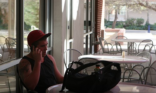 Rebecca Rillos / Arizona Daily Wildcat

Christian Heaviland, a pre-business freshman, talks on his cell phone in the patio of the Park Student Union on Friday, Feb. 25, 2010. 