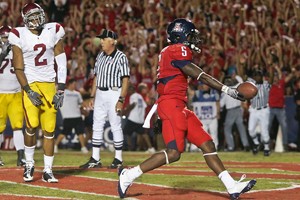 UA running back Nic Grigsby celebrates after scoring a touchdown, his 10th of the season, during a 17-10 Wildcat loss to USC on Oct. 25 at Arizona Stadium. Grigsby could significantly add to his scoring total against Washington State this weekend as he will face a rush defense that allows nearly 300 yards rushing per game.