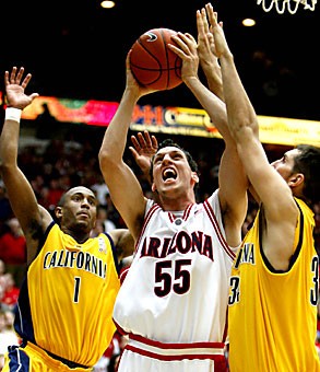 Arizonas Ivan Radenovic splits Californias Ayinde Ubaka, left, and Ryan Anderson as he goes for a layup during the Wildcats 94-85 win over the Golden Bears Dec. 28 in Tucson. Radenovic and the Wildcats will have their hands full with Cals perimeter shooting, ranked No. 2 in the conference in 3-pointers made.