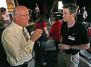 Tucson Mayor Bob Walkup, left, talks with Rick Chesney, a junior majoring in business and architecture, about his plans for Tucson at a campaign event at Gentle Bens yesterday afternoon.