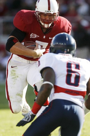 Jake Lacey/Arizona Daily Wildcat Stanford running back Toby Gerhart tries to get around UA cornerback Devin Ross in Saturdays 24-23 Cardinal win in Palo Alto, Calif.