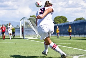 UA midfielder Samantha Drees lofts in a corner kick during the Wildcats 2-1 overtime win over Cal-State Northridge on Sunday. The soccer team has a pair of home games this weekend against Long Beach State tonight at 7 and UC Santa Barbara Sunday night at 5.