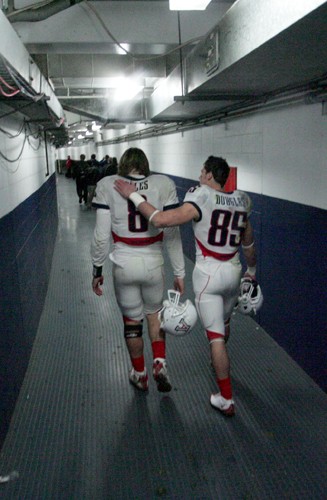 Quarterback Nick Foles, left, is consoled by wide receiver David Douglas after Arizona lost 33-0 to Nebraska at the Holiday Bowl on Dec. 30. Foles and the Wildcats ended an otherwise successful season with a poor performance at Qualcomm Stadium.