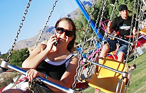 Secondary Education freshman Alicia West (front) and 19-year-old Tucsonian Nick Remington ride the YoYo on the opening day of Spring Fling, Thursday April 6, 2006. (Chris Coduto/Arizona Daily Wildcat)