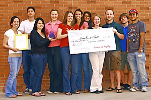 Representatives from Yuma Residence Hall and the Residence Hall Association received $1,000 toward future recycling after winning the annual RecycleMania competition.