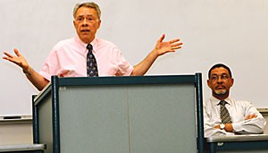 Nicholas Capaldi, a professor in the College of Business at Loyola University, presents his argument on affirmative action at the James E. Rogers College of Law building, while the Rev. Elwood J. McDowell listens and waits to respond.