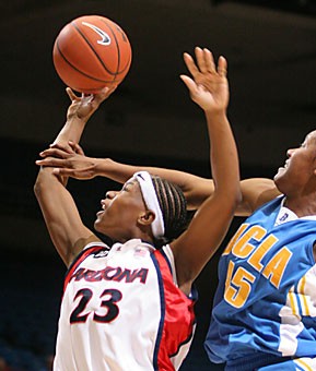 Arizona senior guard Natalie Jones tries to complete the play while being fouled by UCLAs Noelle Quinn during the Wildcats 90-64 loss to the Bruins in McKale Center Feb. 3. The Wildcats are on an eight-game losing streak as they head to Tempe to take on the Sun Devils tomorrow. Arizonas senior class has not won in Tempe during its career in Tucson.
