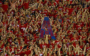 Students in the Zona Zoo section cheer on the Wildcat football team as it takes the field before the game against New Mexico on Sept. 15 at Arizona Stadium. Approximately 120 Zona Zoo cardholders requested a refund before a Friday deadline. 