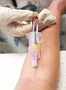 A nurse draws blood for testing Monday at Campus Health Services. 