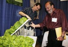 Amanda Purciello / Arizona Daily Wildcat

Myles Lewis, left, shows Raphael Gruener, director of Technol Initiatives, right, the modular portable crop growth system developed by Verdant Earth Technology, yesterday afternoon as part of Innovation Day held in the Student Union Memorial Center.