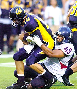 Senior Copeland Bryan sacks California quarterback Joe Ayoob during the second half of Arizonas game against the Golden Bears Oct. 1 at Memorial Stadium in Berkeley, Calif. Bryan, who led the team with 7.5 sacks, went undrafted during this weekends NFL draft but signed with the Tennessee Titans as a free agent. 