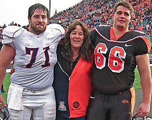 Erick Levitre, left, and his younger brother Andy pose with their mother, Sheri, after Arizonas 29-27 road win over Oregon State last year. Andy, a sophomore for the Beavers, has cracked the starting lineup in Oregon States offensive line, while Erick, a fifth year senior and last years starting center, has been relegated to mop-up duty. 