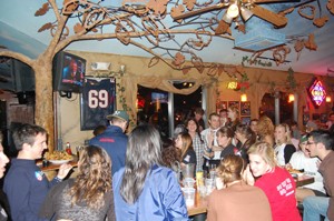 Students from ASUA crowd around the TVs at Gentle Bens Bar on North University Boulevard as the 2008 Presidential Election results come in.