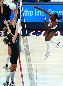 UA middle blocker Dominique Lamb stays in the air after spiking the ball during the Wildcats three-game loss to No. 18 Colorado State on Friday night in McKale Center. The senior recorded her 507th block assist to take over at second place on the all-time list. 